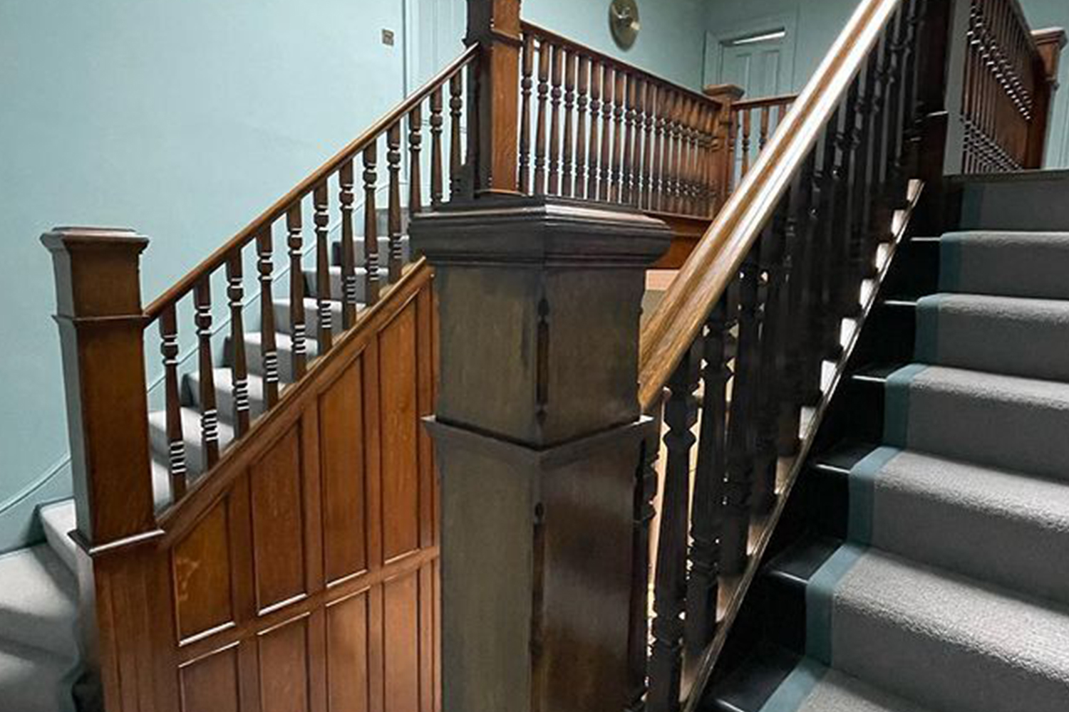 Staircase with wooden handrail after polishing