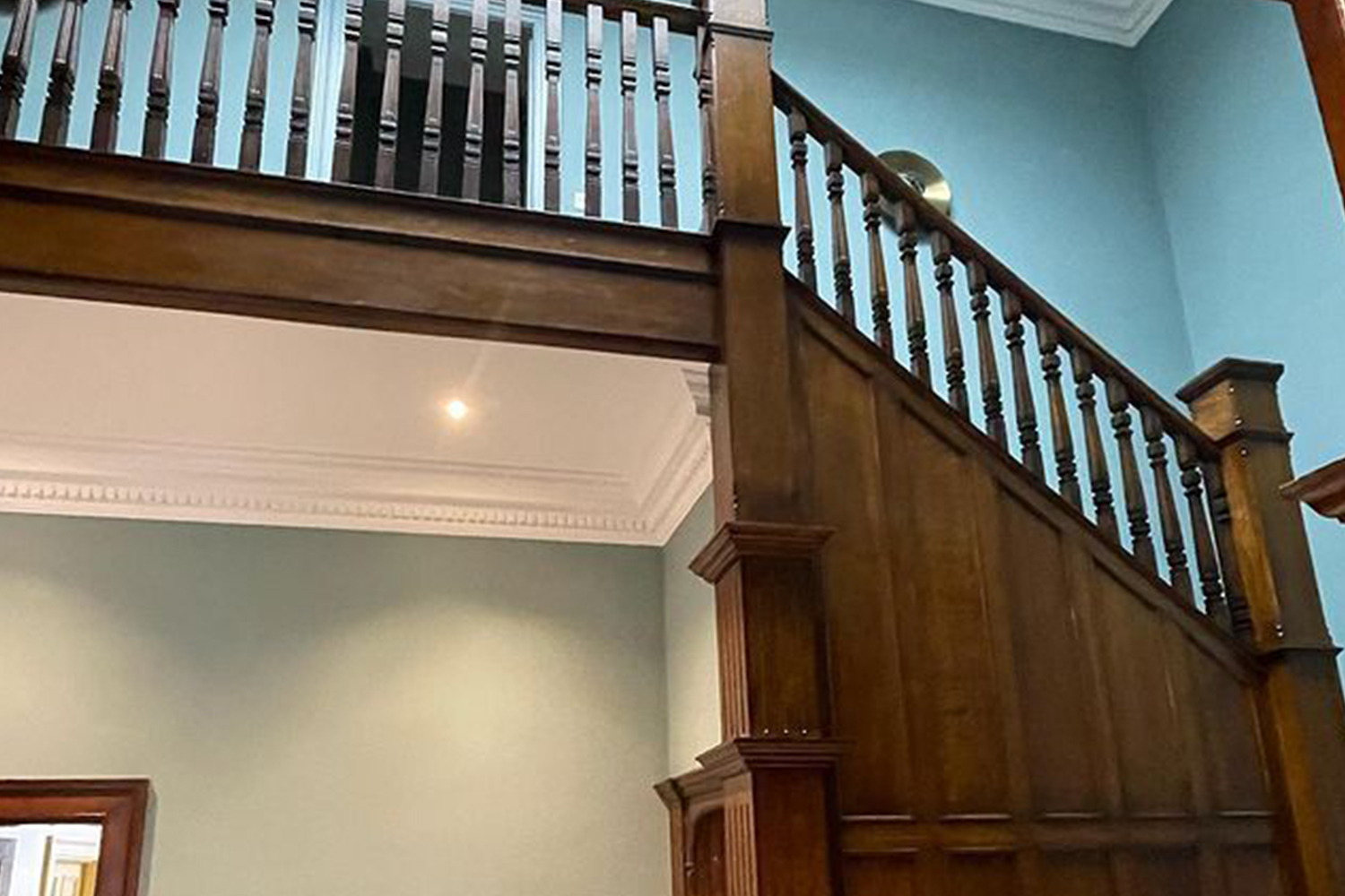 A staircase with elegant wooden banisters after polishing