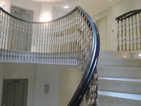 A staircase with contrasting black and white railings